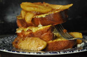 day old brioche stuffed with sugared cream cheese, dipped in egg milk mixture, fried and topped with apples slices sautéed with butter, sugar and cinnamon